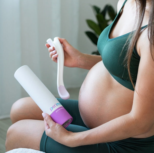 Pregnant woman using Perimom Perineal Massager in a relaxing home environment