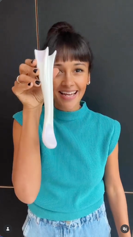 Poppy Child of Pop That Mumma holding the Perimom perineal massage tool